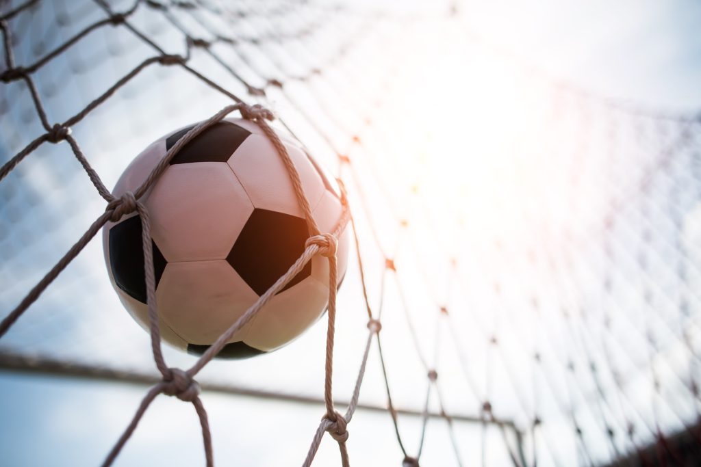 Soccer into goal success concept @freepik